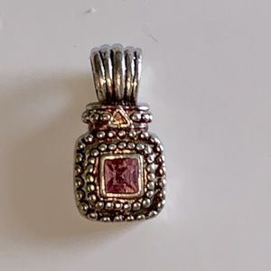 Pink gemstone and silver pendant